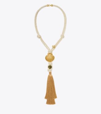 Halsband med hänge i form av snäcka och tofs