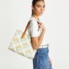 Liten T Monogram kontrastpräglad tote