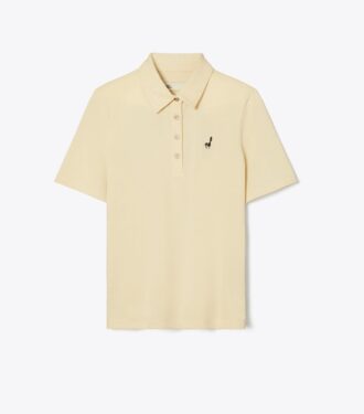 Polo i bomull med broderad fågel