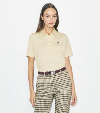 Polo i bomull med broderad fågel